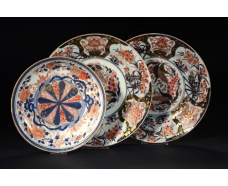 A PAIR OF JAPANESE IMARI DISHES AND A SAUCER DISH, BOTH EDO PERIOD, EARLY 18TH C  24 and 30cm diam ++Some light wear, slightl
