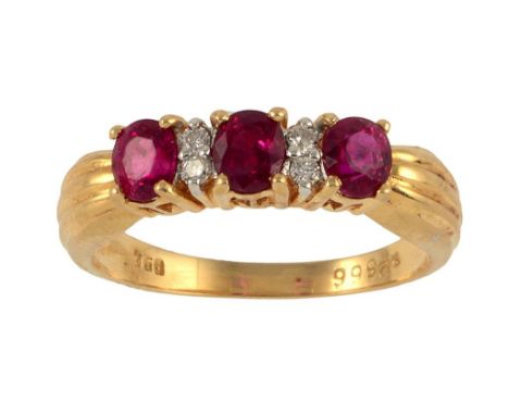 A RUBY AND DIAMOND RING in gold, with fluted shoulders, marked 750, inventory number, 4g, size N ++In fine condition with lit