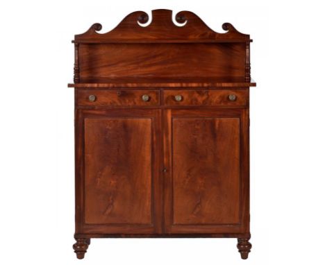 A GEORGE IV MAHOGANY CHIFFONIER, C1830 the swan neck back with applied roundels, 33cm h; 38 x 98cm  ++In good restored condit