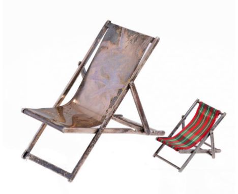 TWO UNUSUAL MINIATURE SILVER WORKING MODEL DECK-CHAIRS  4.5 and 10cm h, one maker JRF, London 1979, the other marked SILVER, 