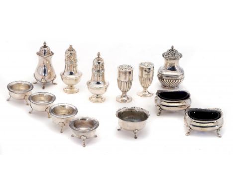 ONE, A PAIR AND SET OF FOUR SILVER SALT CELLARS AND FOUR AND A PAIR OF SILVER PEPPER CASTERS  various sizes and makers, Londo