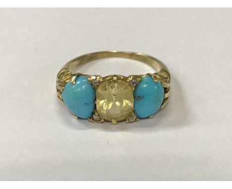 A gold mounted turquoise and diamond set ring with central oval cut pale yellow stone, size M