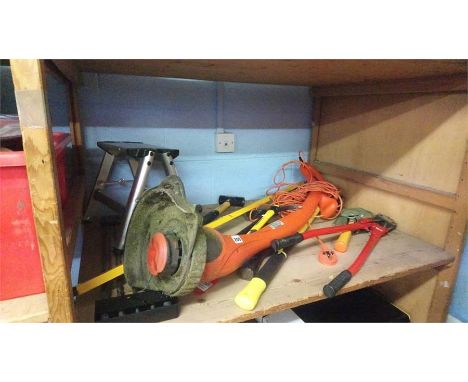 Shelf of garden tools.