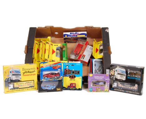 A collection of assorted boxed diecast model cars. To include Maisto Sportscar Collection, Lledo Days Gone, Oxi, Burago, Matc