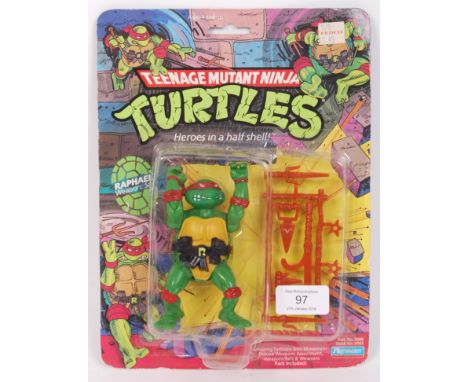 An original vintage Playmates made Teenage Mutant Ninja Turtles carded first issue 10 back action figure of ' Raphael .' Seal