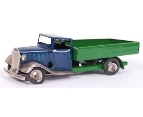 A vintage Triang Minic tinplate clockwork wagon. Green flatbed, with blue cab. Largely in mint condition (tyres degraded). No