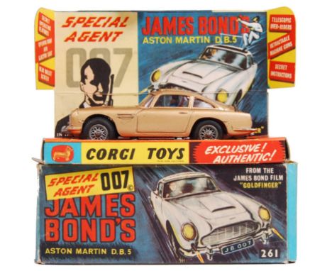 An original vintage Corgi Toys diecast model No. 261 ' James Bond 007 Aston Martin DB5 .' In gold, with silver spoked wheels.