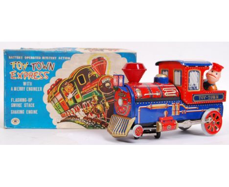 A fabulous vintage 1960's Japanese made Modern Toy Co. ' Toy Town Express ' battery operated tinplate railway locomotive. ' W