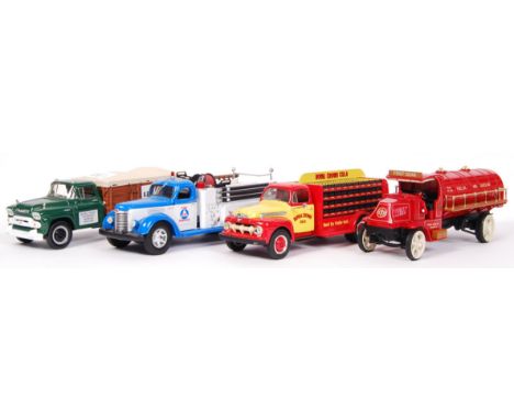 A collection of 4x American made First Gear 1:34 scale precision diecast model trucks. All commercial / haulage related, to i