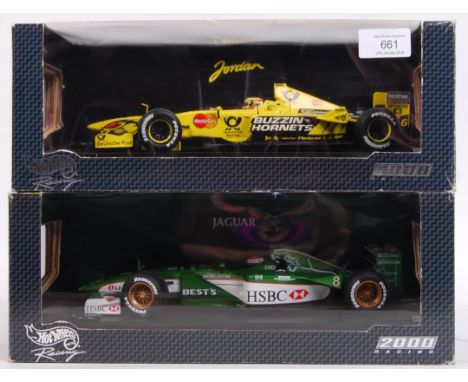 Two precision diecast model Hot Wheels made 1:18 scale ' Racing 2000 ' series Formula One cars. Jarno Trulli 26744 and Johnny