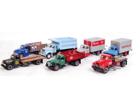 A collection of 7x American made First Gear 1:34 scale precision diecast model trucks. All haulage related - Navajo, Pacemake