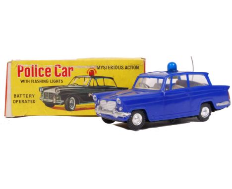 A charming vintage 1960's ' Made In Hong Kong ' Battery Operated ' Police Car With Flashing Lights ,' toy. Appears largely ve