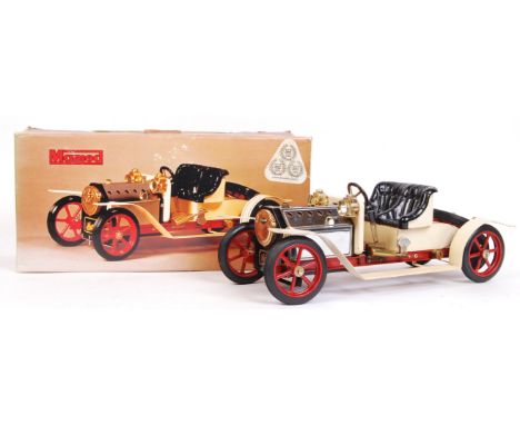 A fabulous vintage Mamod made live steam ' Roadster ' car. Cream and red. Appears never to have been fired, and is generally 