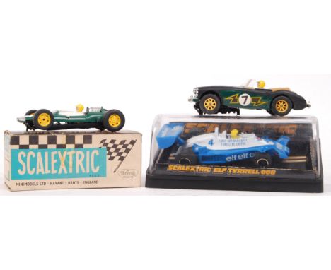 A collection of 3x vintage Scalextric slot racing cars, comprising of; C82 Lotus (with original box), C135 Tyrrell 008 (in ou