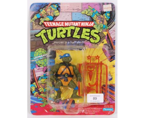 An original vintage Playmates made Teenage Mutant Ninja Turtles carded first issue 10back action figure of ' Leonardo .' Unpu