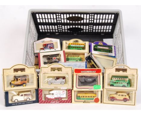 A collection of 25+ assorted boxed 1:43 scale diecast model vehicles. To include Lledo Days Gone, Vanguards, Oxford. Some lim