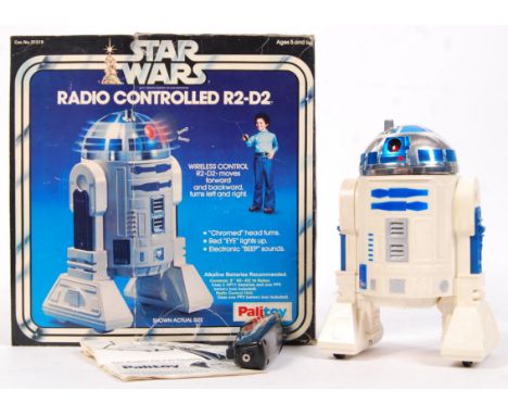 An original vintage Star Wars Palitoy made ' Radio Controlled R2D2 ' action figure droid. With remote (missing antenna), and 