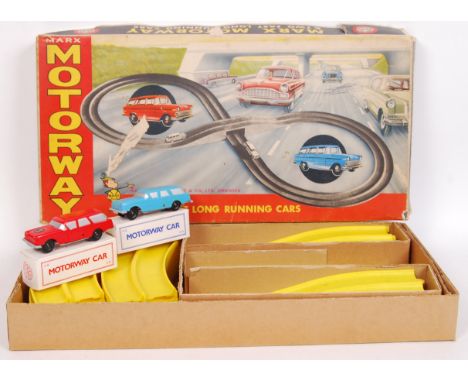 An original vintage Marx Toys ' Motorway ' racing set, with rare variation yellow track. Appears complete with both clockwork