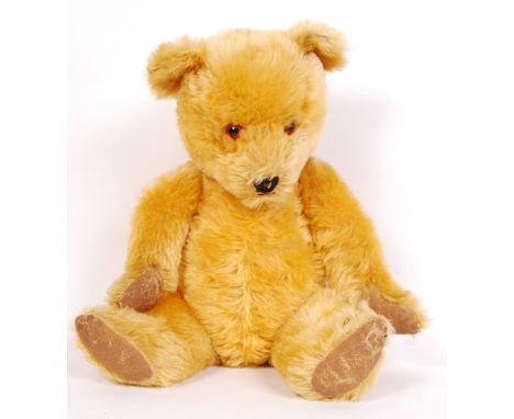 A large and impressive vintage c1950's Chiltern made teddy bear. Golden mohair fur, with inset glass eyes, leather pads and w