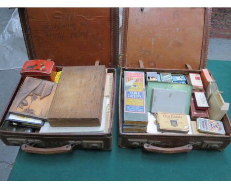 TWO CASES CONTAINING SUNDRIES INCLUDING FLATWARE, CIGARETTE CARDS, LIGHTER, PLAYING CARDS, ETC. 