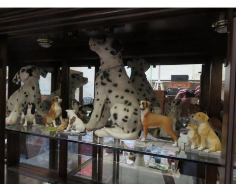 COLLECTION OF VARIOUS UNGLAZED CERAMIC DOGS