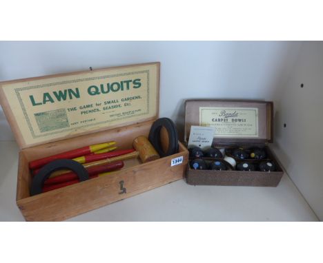 A lawn quoits garden game with box and a set of Banda carpet bowls in a box 