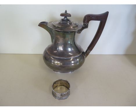 A silver water jug and a silver serviette ring, total weight approx 15 troy oz 