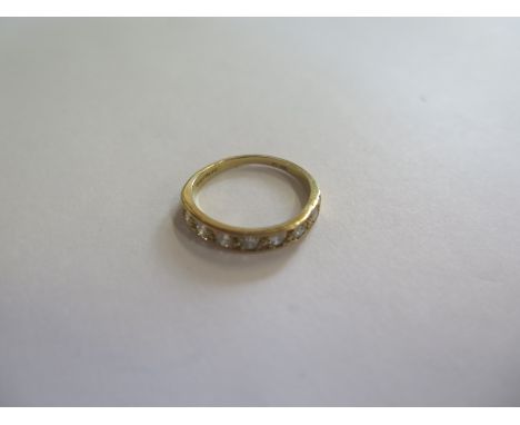 An 18ct gold, seven diamond half eternity ring, approx 0.35ct, approx 2.3 grams, size L - in good condition 