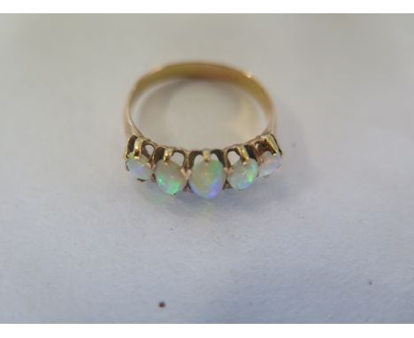 A 9ct gold opal five stone ring, size O, approx 2.2 grams, generally good