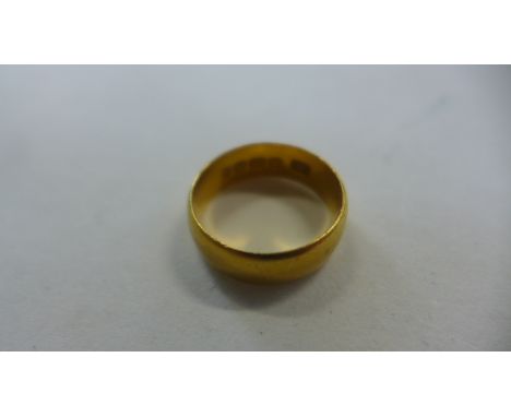 A 22ct gold ring, size K, approx 5.8g, in good condition but with some light surface wear 