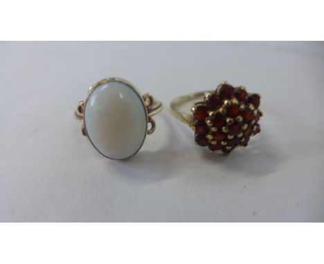 A 9ct yellow gold cluster ring and a 9ct yellow gold opal ring, both size R, total weight approx 8.3 grams, both generally go