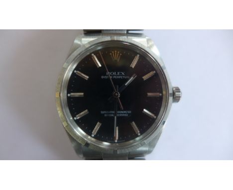 A gents Rolex Oyster Perpetual automatic wristwatch with black dial and stainless steel bracelet case, width approx 35mm incl