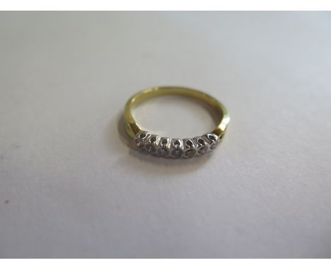 An 18ct gold diamond seven stone ring, approx 3.1 grams, size Q, new condition 