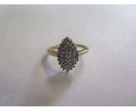 A 9ct gold and diamond marquise shaped cluster ring, size L, approx 2.7 grams, in good condition 