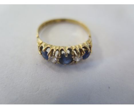 An 18ct gold diamond and sapphire ring, size Q, approx 3.5 grams, generally good, some minor abrasions