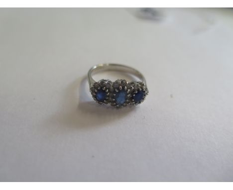 An 18ct white gold, sapphire and diamond ring, size M, approx 3.6 grams, in new condition 