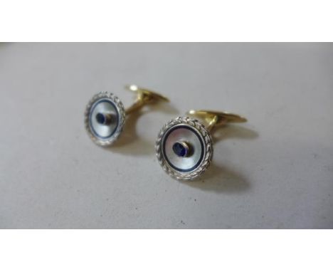 A pair of French designer 14ct gold platinum and sapphire cufflinks with blue enamel, one cufflink numbered 2090, numbers sli