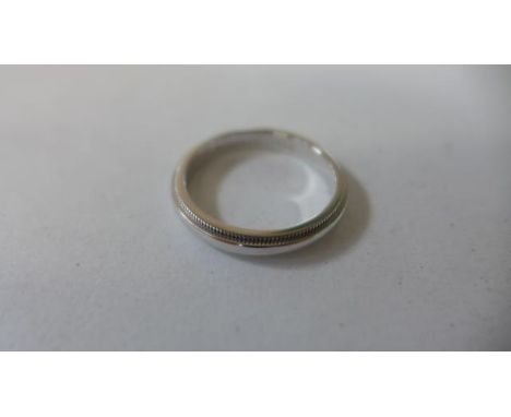 A Tiffany and co platinum ring, size N, approx 5.8 grams, in good condition 