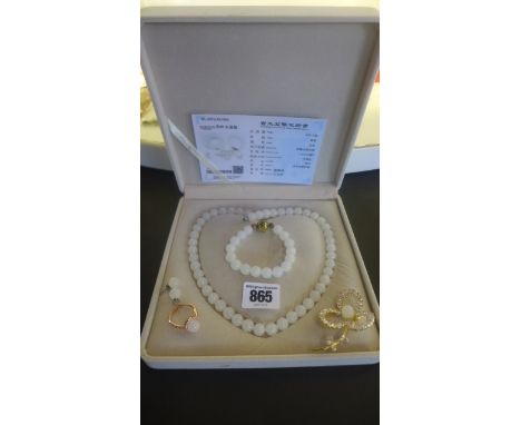A white jade necklace - 47cm long, a bracelet, earrings, ring and brooch 