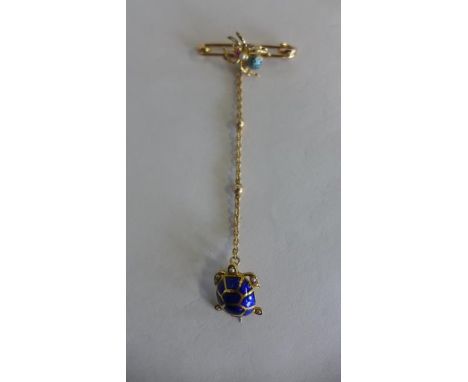 A gilt metal enamel and pearl brooch, in the form of a turtle suspended on a spiders chain, length 9cm, total weight approx 7