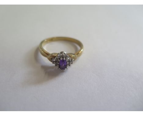 A 9ct gold diamond and amethyst dress ring, size Q, approx 2.8 grams, in good condition 