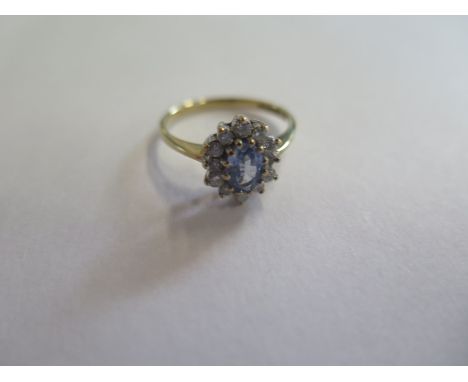 A 9ct gold diamond and tanzanite dress ring, approx 2 grams, size M - in good condition 