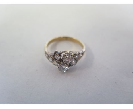 An un hallmarked gold and white metal diamond ring, set with ten diamonds, size K/L approx 2.7 grams diamonds bright, general