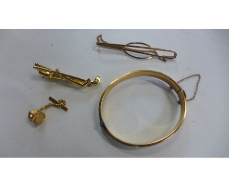 A collection of gold plated jewellery, two tie clips, a bangle and a stud - most in good condition but some tarnished areas 
