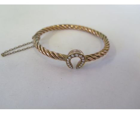 A Victorian gold bangle set with pearls, 6.5cm x 6cm, approx 11.3 grams, wear consistent with age, but generally good 