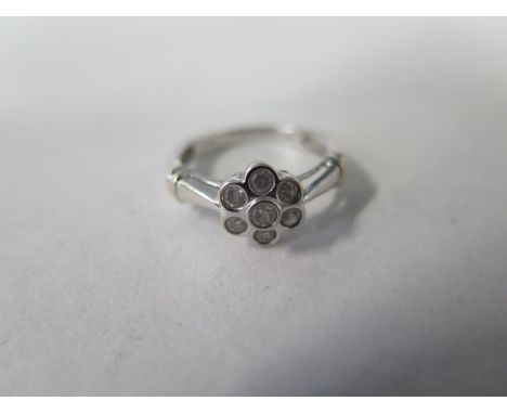 A 14ct white gold seven stone diamond cluster ring, approx total 0.70ct weight - ring size M/N - approx 2.8 grams, some small