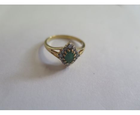 An 18ct gold diamond and emerald dress ring, size M, approx 3.2 grams, in new condition 