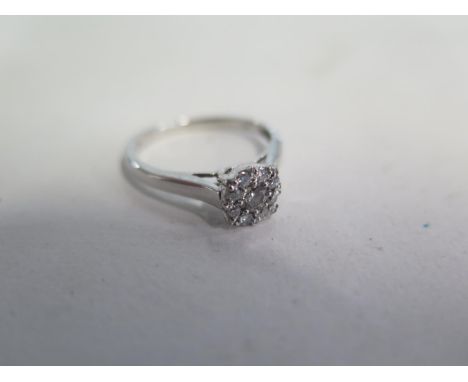 A 9ct white gold cluster ring size O/P approx 2.5 grams, in good condition, head measures 6mm x 6mm 