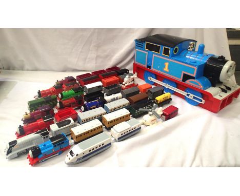 Large selection of Tomy battery operated Thomas The Tank road/rail set. Includes 11x locos, 22x wagons/coaches, track, buildi