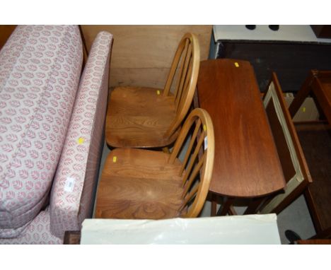 A pair of light ercol stick back kitchen chairs; a small teak drop leaf table and an oak framed and needlework fire screen 